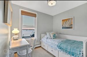 Ένα ή περισσότερα κρεβάτια σε δωμάτιο στο Portside Suite