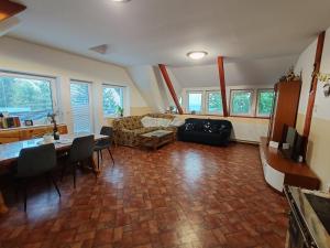 a living room with a couch and a table at apartma Pohorc - Kostanj in Hočko Pohorje