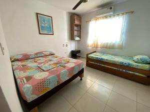 Postel nebo postele na pokoji v ubytování Casa de Playa Manecal