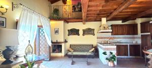 a kitchen with a table and a stove in a room at Antica Rupe 80 mq Casa Vacanze in Castel SantʼElia +31 photos