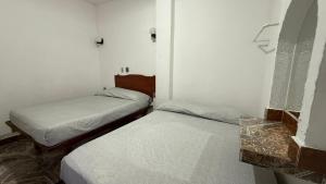 Postel nebo postele na pokoji v ubytování Hotel Climar