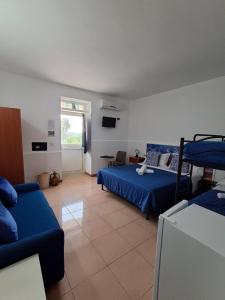 Postel nebo postele na pokoji v ubytování Osteria B&B Il Rifugio