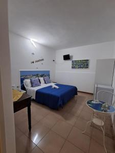 Postel nebo postele na pokoji v ubytování Osteria B&B Il Rifugio