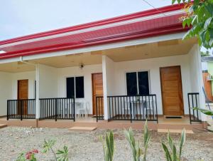 a rendering of a house with a red roof at Felomina Guesthouse in San Juan