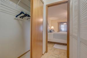 a hallway leading to a bedroom with a bed at Private Suite with Full Kitchen 5 ml to Beach in Clearwater