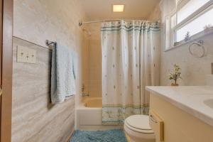 a bathroom with a toilet and a shower and a sink at Private Suite with Full Kitchen 5 ml to Beach in Clearwater