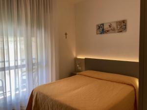 Postel nebo postele na pokoji v ubytování Hotel Giacomazzo