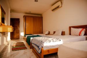 A bed or beds in a room at Station House
