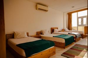 A bed or beds in a room at Station House