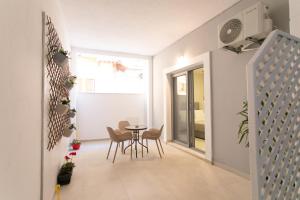 a small dining room with a table and chairs at Four Diamonds in Parga