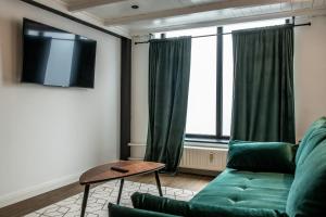 Μια τηλεόραση ή/και κέντρο ψυχαγωγίας στο Oran Apartment 1