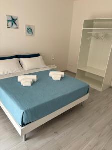 Postel nebo postele na pokoji v ubytování BluMare Ospiti