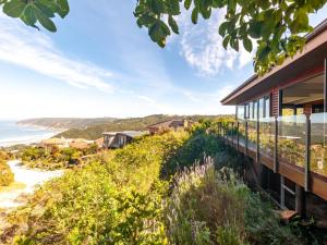 a house on a hill with a view of the ocean at CK House in Wilderness