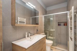 a bathroom with a sink and a shower and a toilet at Argostoli Haven - Luxury House in Argostoli +43 photos