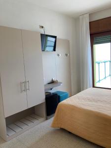 Postel nebo postele na pokoji v ubytování Hotel Giacomazzo