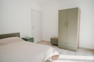 Postel nebo postele na pokoji v ubytování Casa vacanza Ro-Bè