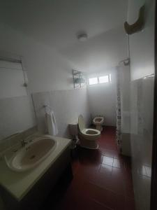 a bathroom with a sink and a toilet at Hotel Cerro Castillo in Viña del Mar +15 photos
