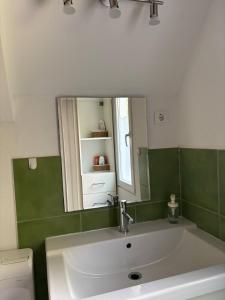 a bathroom with a sink and a mirror at Búj-Lak Dunakanyar in Tahitótfalu +22 photos
