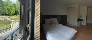 Katil atau katil-katil dalam bilik di Le Victor Hugo - Hôtel et Restaurant - Logis Hôtels