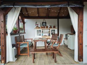 a dining room with a table and chairs at Emena Art Guesthouse in Emen