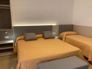 Postel nebo postele na pokoji v ubytování Hotel Giacomazzo