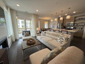 a living room with a couch and a table at The Pointe Unit 321 by 30A Escapes in Rosemary Beach