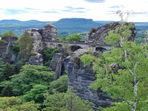 an old bridge on a cliff in the mountains at Sebnitz Garden Retreat in Lichtenhain