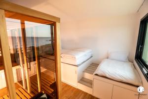 Postel nebo postele na pokoji v ubytování Villa Ponant 5 étoiles à Doëlan, piscine face mer + 41 fotografií
