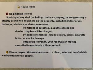 a sign on a wall with a document at Crumlin Road Town House in Belfast +15 photos