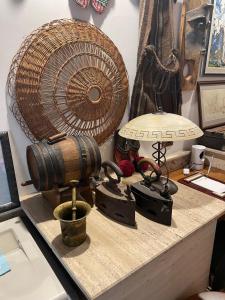 a table with a fan and other items on it at DB Apartment in Tirana
