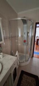 a bathroom with a shower and a sink at Casa Santos in Angra do Heroísmo +40 photos