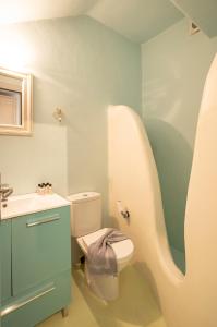 a bathroom with a toilet and a sink at Villa Azallea by Mykonian Kazarte in Kalafatis +19 photos
