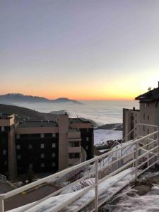 a view from the balcony of a building in the snow at Fantastico Refugio en La Parva in La Parva