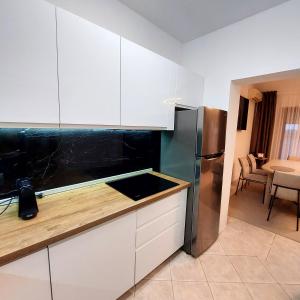 Kuchyň nebo kuchyňský kout v ubytování Apartaments Victoria