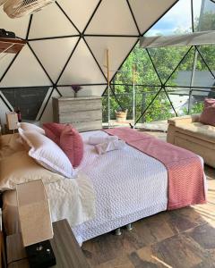 a bedroom with a bed in a tent at Eco Boutique-Naranjo in La Vega
