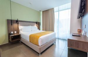 Postel nebo postele na pokoji v ubytování Hotel Zi One Luxury