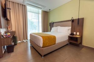 Postel nebo postele na pokoji v ubytování Hotel Zi One Luxury