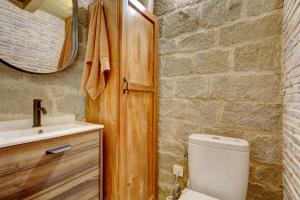 a bathroom with a toilet and a sink at Bodega La Tomata in Cihuri +20 photos