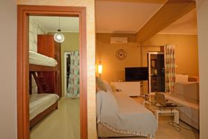 A television and/or entertainment centre at Mpoulakis Apt 98