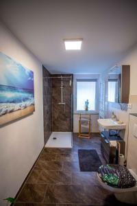a bathroom with a shower and a sink at Altstadtidyll 50qm - Terrace - Central - Washer in Neuhaldensleben