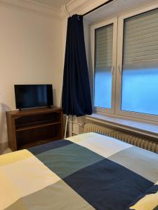 Chambre double à Niederkorn 객실 침대