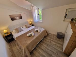 Postel nebo postele na pokoji v ubytování Apartments MB
