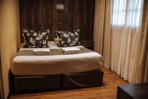 a bedroom with a large bed in a room at Gran Hotel Potrerillos in Potrerillos +56 photos