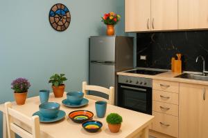 a kitchen with a table with dishes on it at Tirana Old Street 2 in Tirana +8 photos