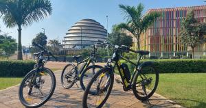 two bikes parked on a sidewalk in front of a building at Kigali Haven Apartment in Kigali