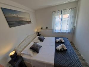 Postel nebo postele na pokoji v ubytování Apartments MB