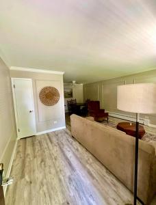 a living room with a couch and a table at Oak Park Oasis Near Chicago in Oak Park