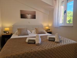 Postel nebo postele na pokoji v ubytování Apartments MB