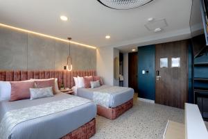 Ένα ή περισσότερα κρεβάτια σε δωμάτιο στο The O by Seekers Medellín