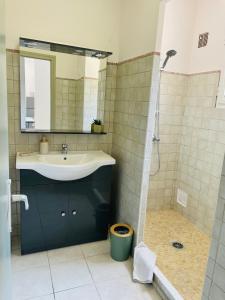 a bathroom with a sink and a shower at Fiori di Luna in Porto-Vecchio +29 photos